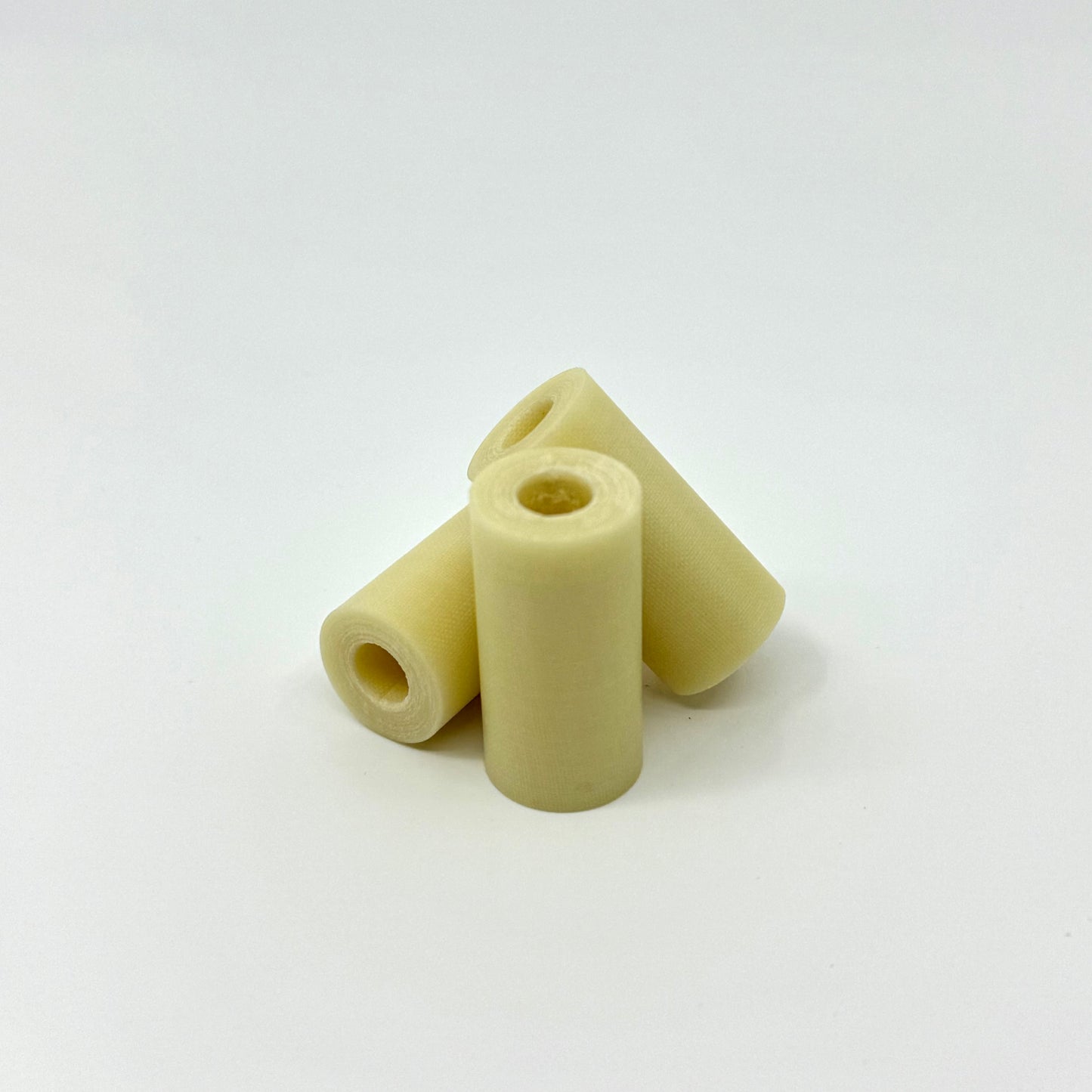 CueForm Vintage Yellow Ivory™ Micarta Ferule .562 OD X 1.1” . Three Ferrules shown.