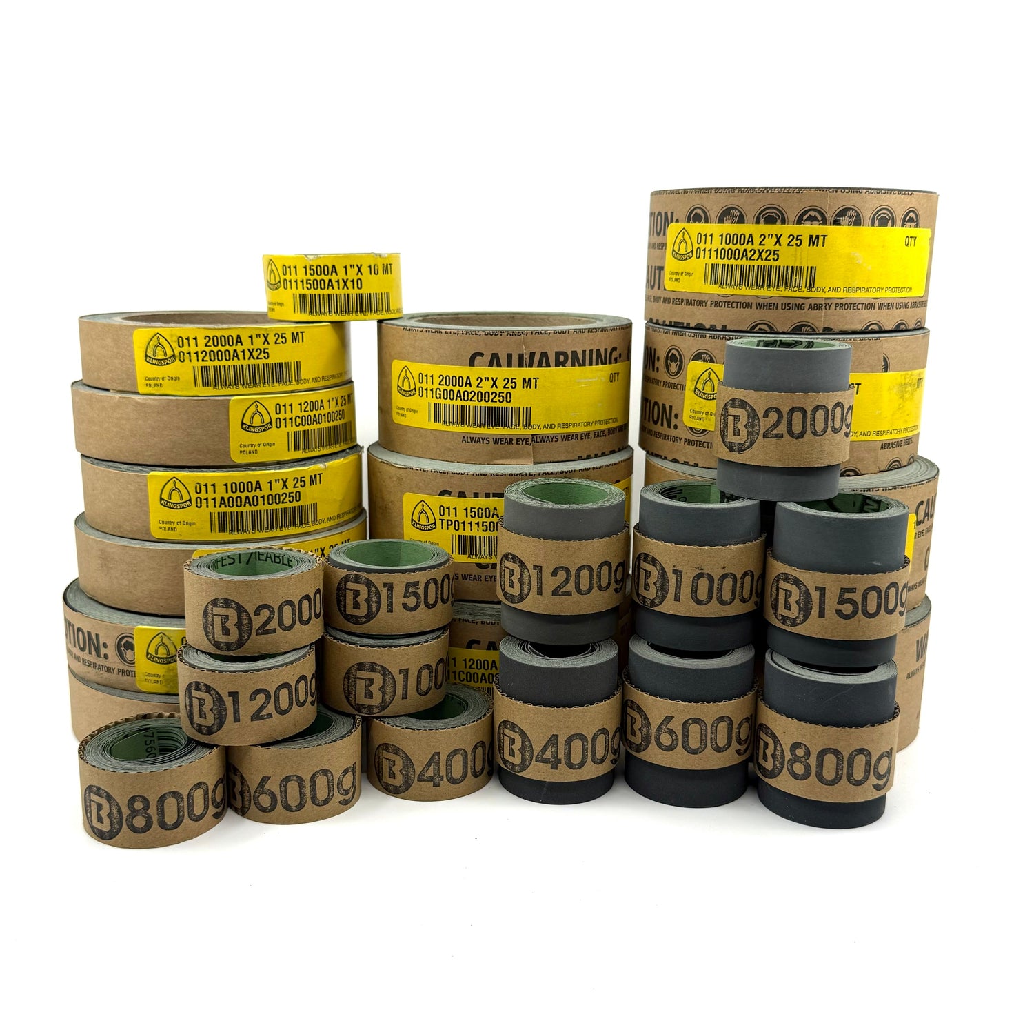 Shown is a stack of Klingspor 1" and 2" Wet/Dry Sandpaper. These are made in Germany, Perfect for Precision Cue Making and Repair. Available in partial 10' strips or 25m rolls.