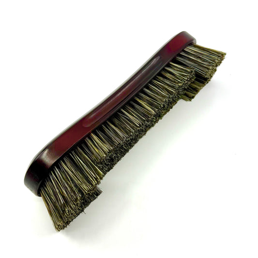 Image of a 10.5-inch mahogany billiards table brush with genuine horsehair bristles and dual-length design for cleaning the bed and under the rails. Laying on its side. 