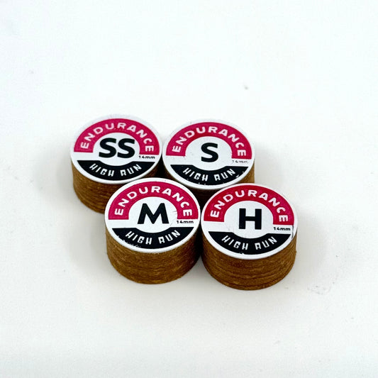 A set of four Endurance High Run brown pool cue tips arranged on a white surface, each tip has the brand name and 'HIGH RUN' text printed on it.