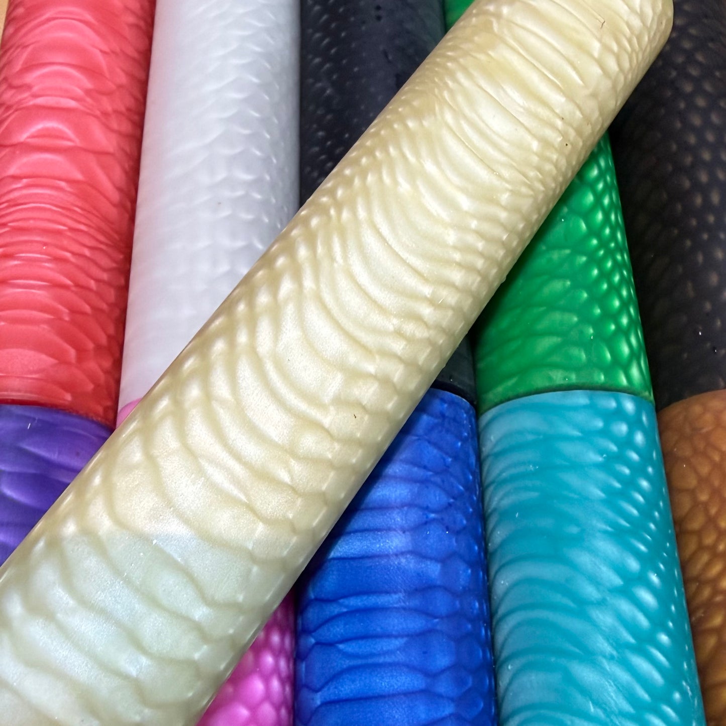DragonSkin™ Material Classic Ivory 32mm shown with other colors behind it.