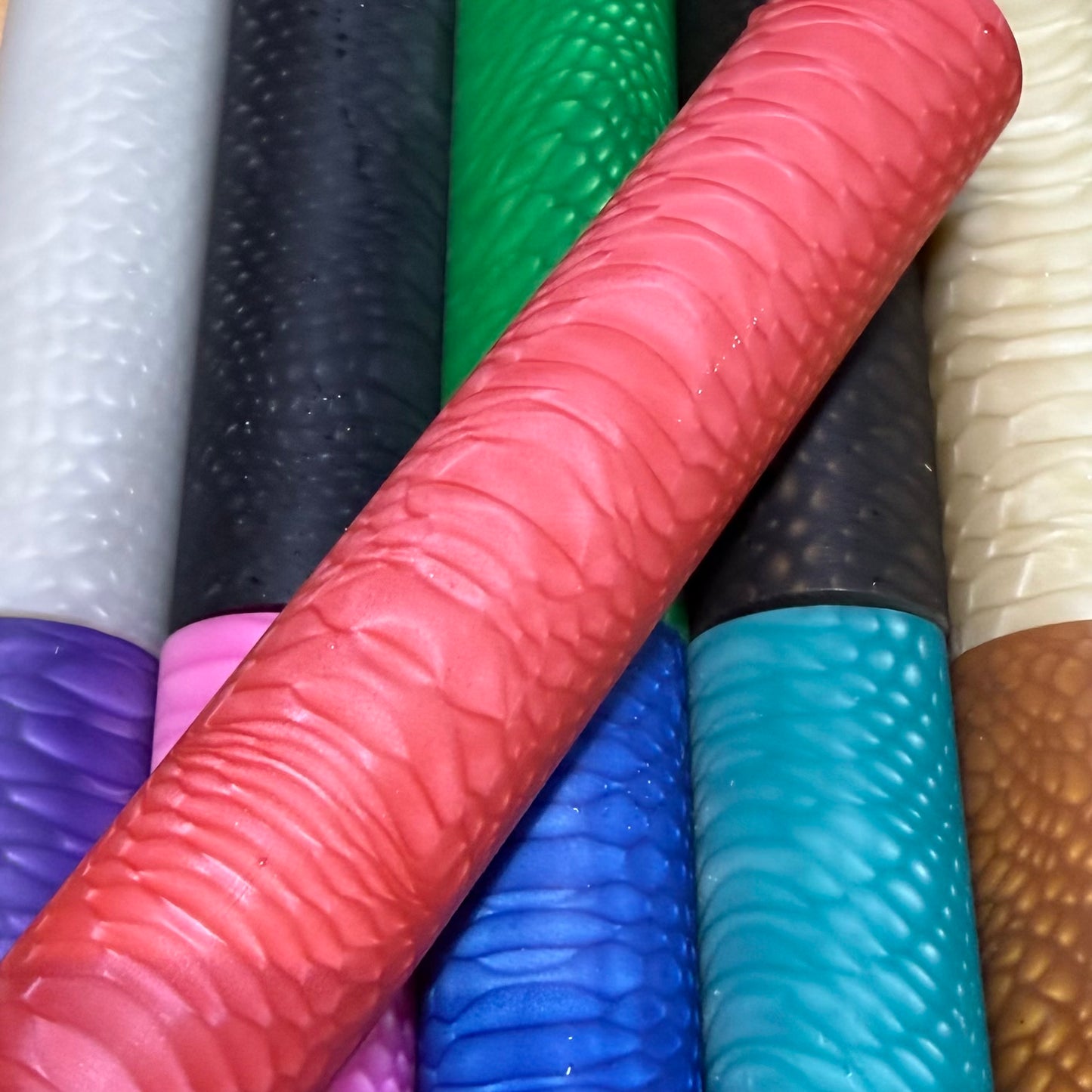 DragonSkin™ Material Crimson Red 32mm shown with other colors behind it.
