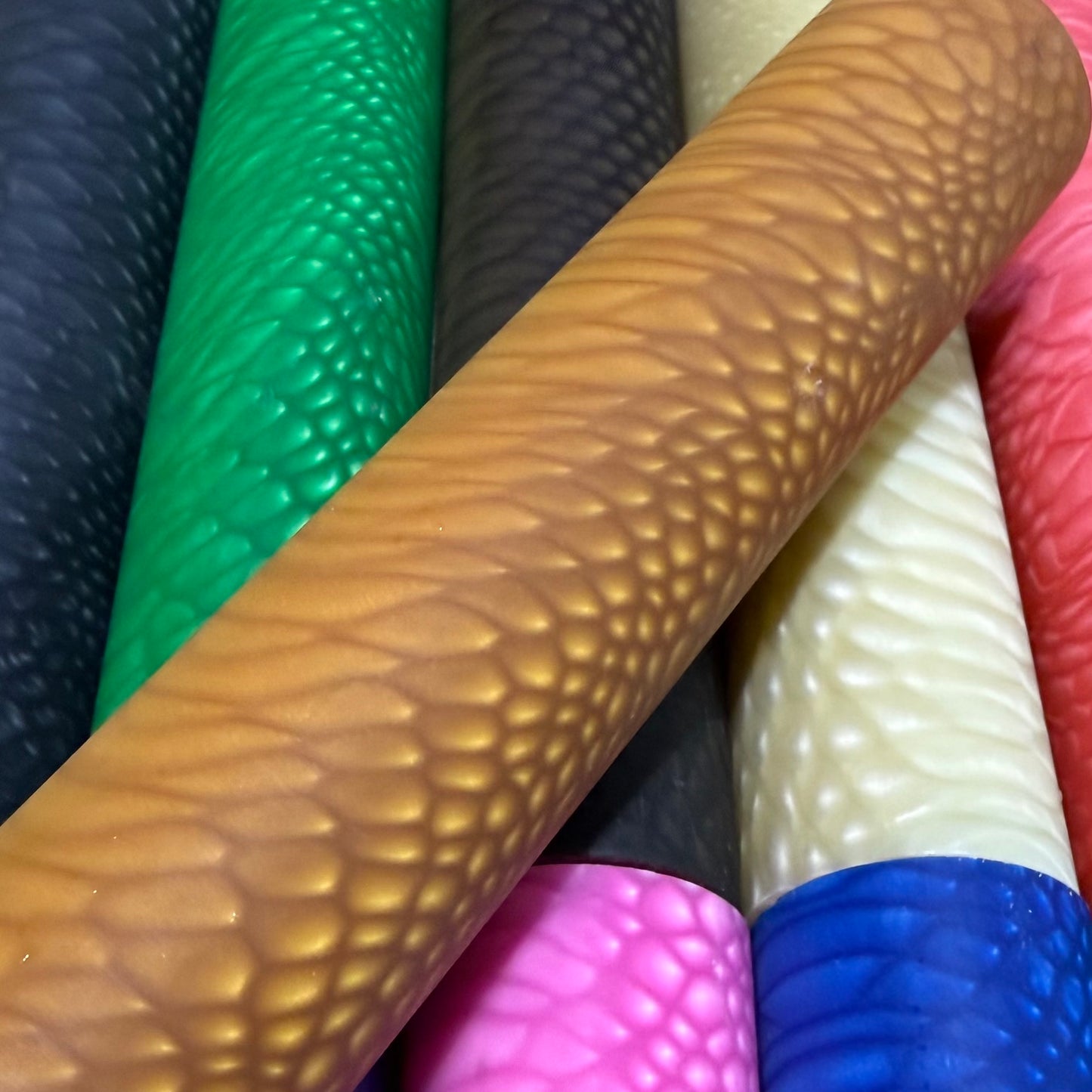 DragonSkin™ Material Desert Tan 32mm shown with other colors behind it.