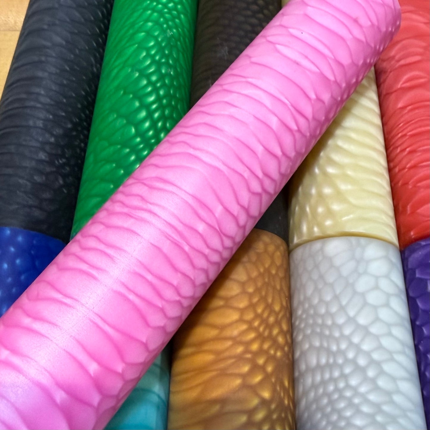 DragonSkin™ Material Hot Pink 32mm shown with other colors behind it.