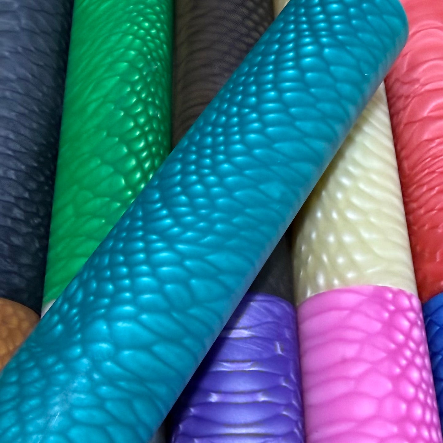 DragonSkin™ Material Ocean Blue 32mm shown with other colors behind it.