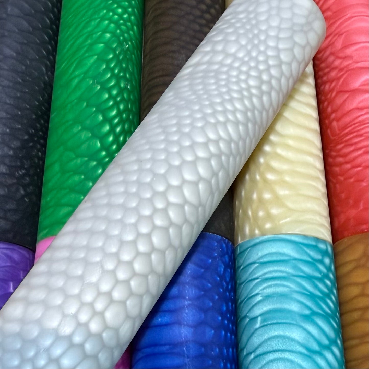 DragonSkin™ Material Pure White 32mm shown with other colors behind it.