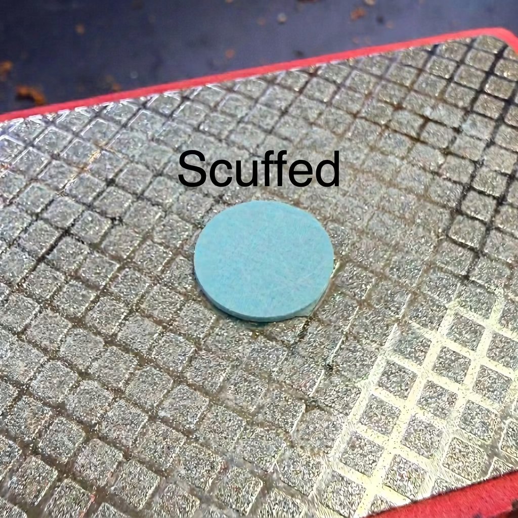 Fiber Ferrule Pool Cue Pad 14mm Light Blue Resting on a Diamond Plated Tip Pad 
