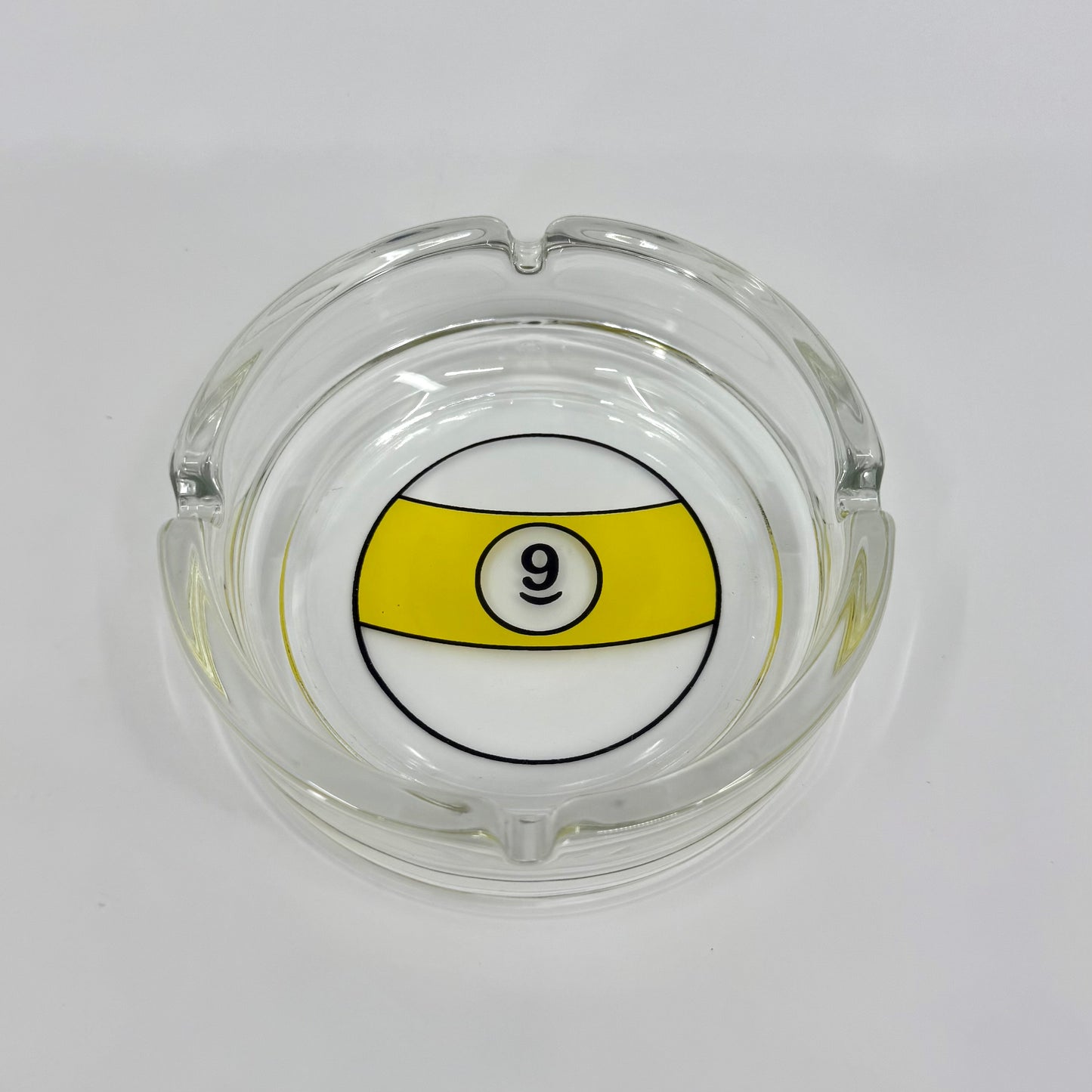 Image of glass billiards themed ashtray 9 Ball pool logo. Lead-free, smooth edges, round shape, and crystal-clear finish.