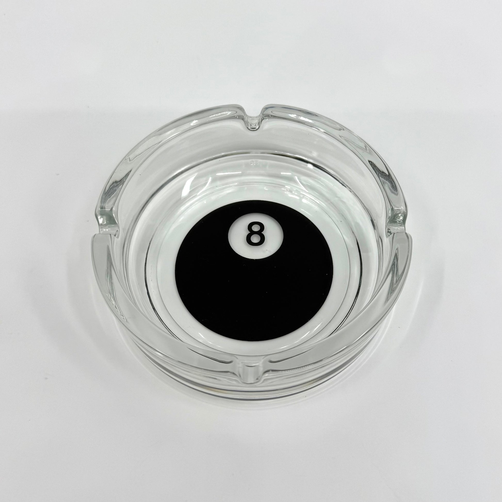 Image of one glass billiards themed ashtray.  8 Ball lead-free, smooth edges, round shape, and crystal-clear finish.