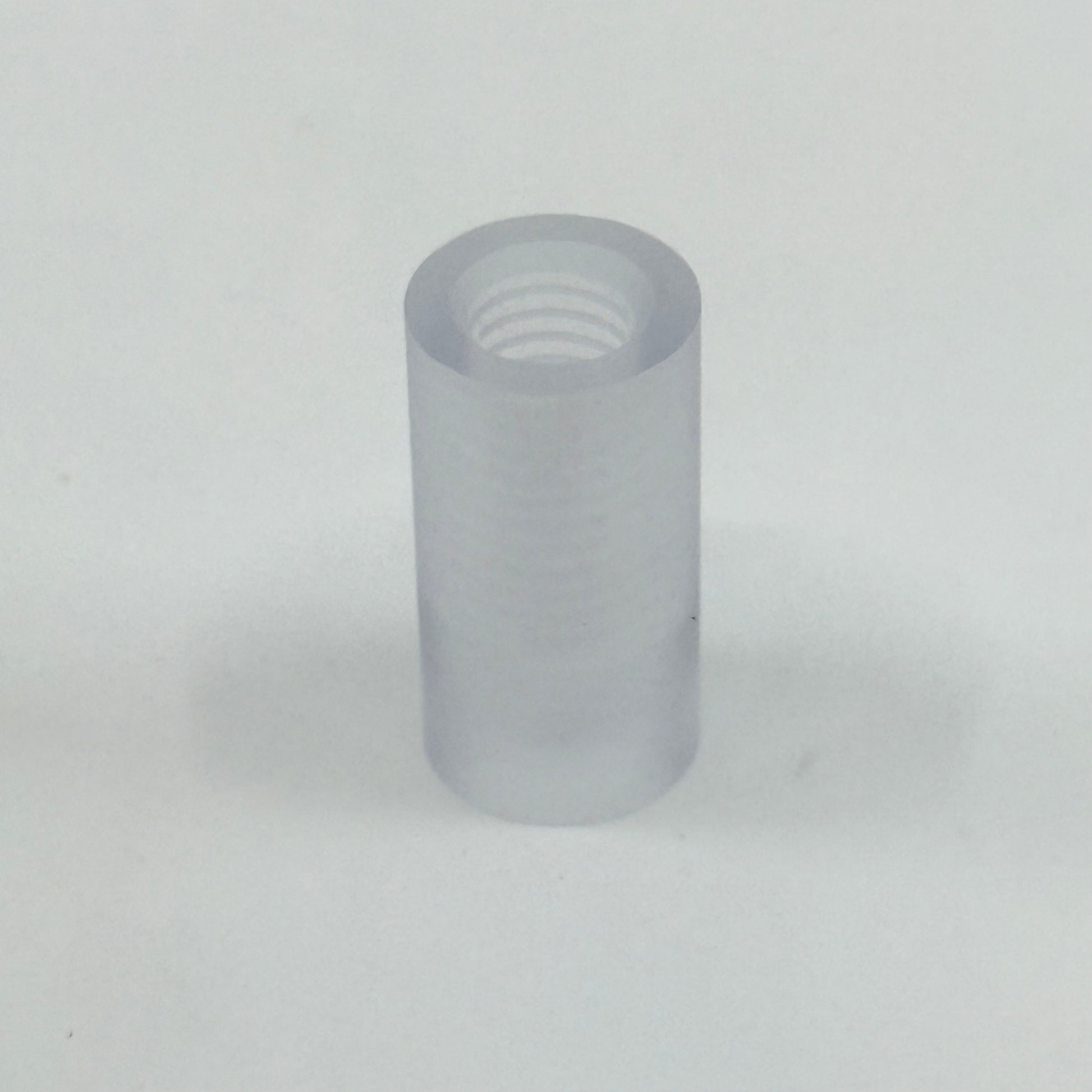 One Lexan_Ferrule_Clear_Tapped. .562" diameter x 1.10" length. Tapped 5/16-18.