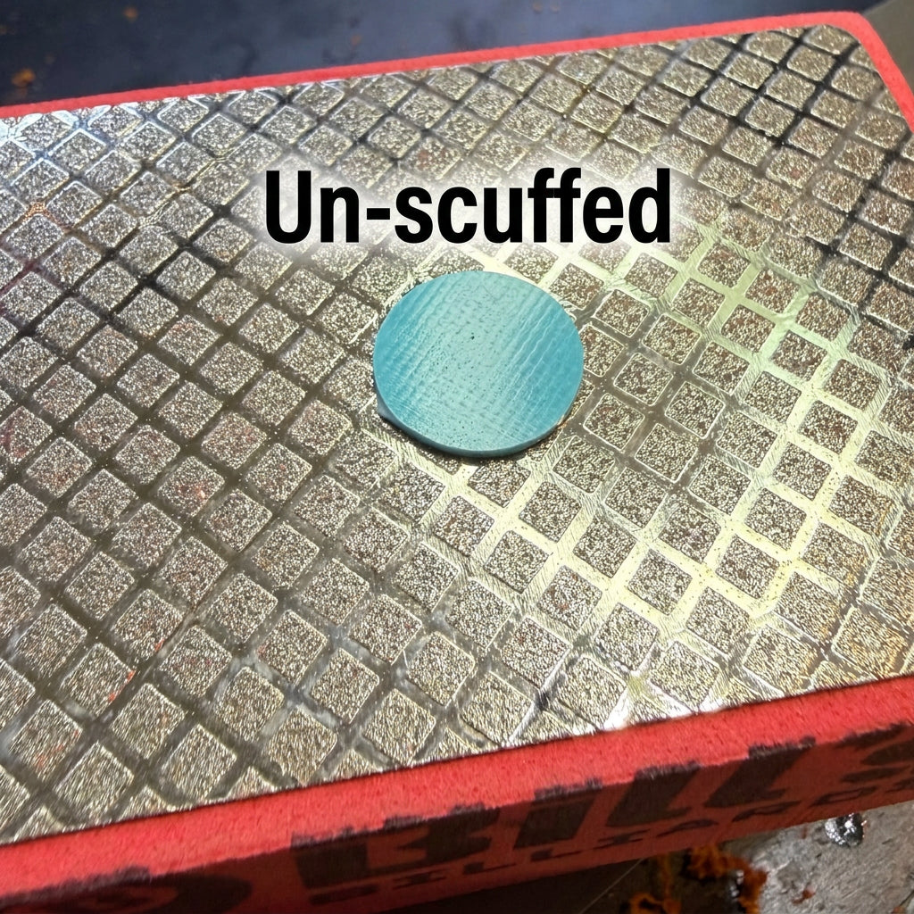 Un-scuffed Firm Fiber Ferrule Pad Resting on Diamond Plated Tip Prep Pad 