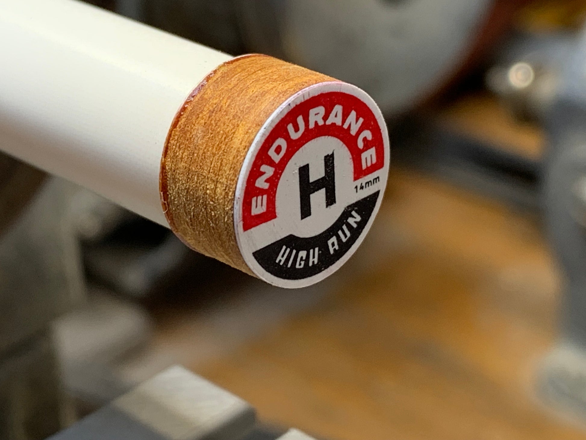 Pool Cue Tip Endurance High Run, Brown. 14mm 8 layer, Japanese pig skin. Image showing tip glued but not completely installed. 