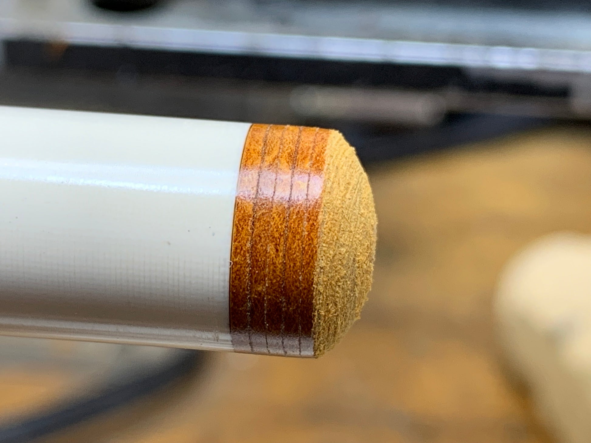 Pool Cue Tip Endurance High Run, Brown. 14mm 8 layer, Japanese pig skin. Image showing tip glued and completely installed. Side view. 