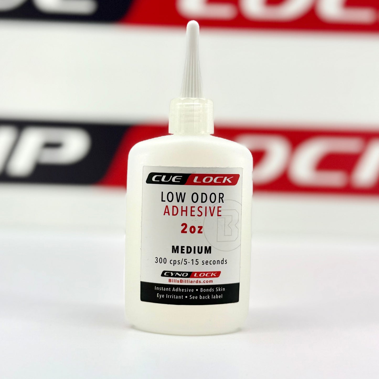 Shown is a bottle of Cue-Lock Low Odor Medium Viscosity Cyanoacrylate Adhesive – 2 oz bottle for safe, general-purpose cue repair and bonding